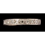 A half hoop nine stone eternity ring, the eight-cut diamonds weighing a total of approximately 0.