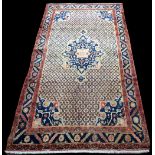 A nomadic Persian rug, with central floral medallion on trellis work ground, 293 x 150cms.