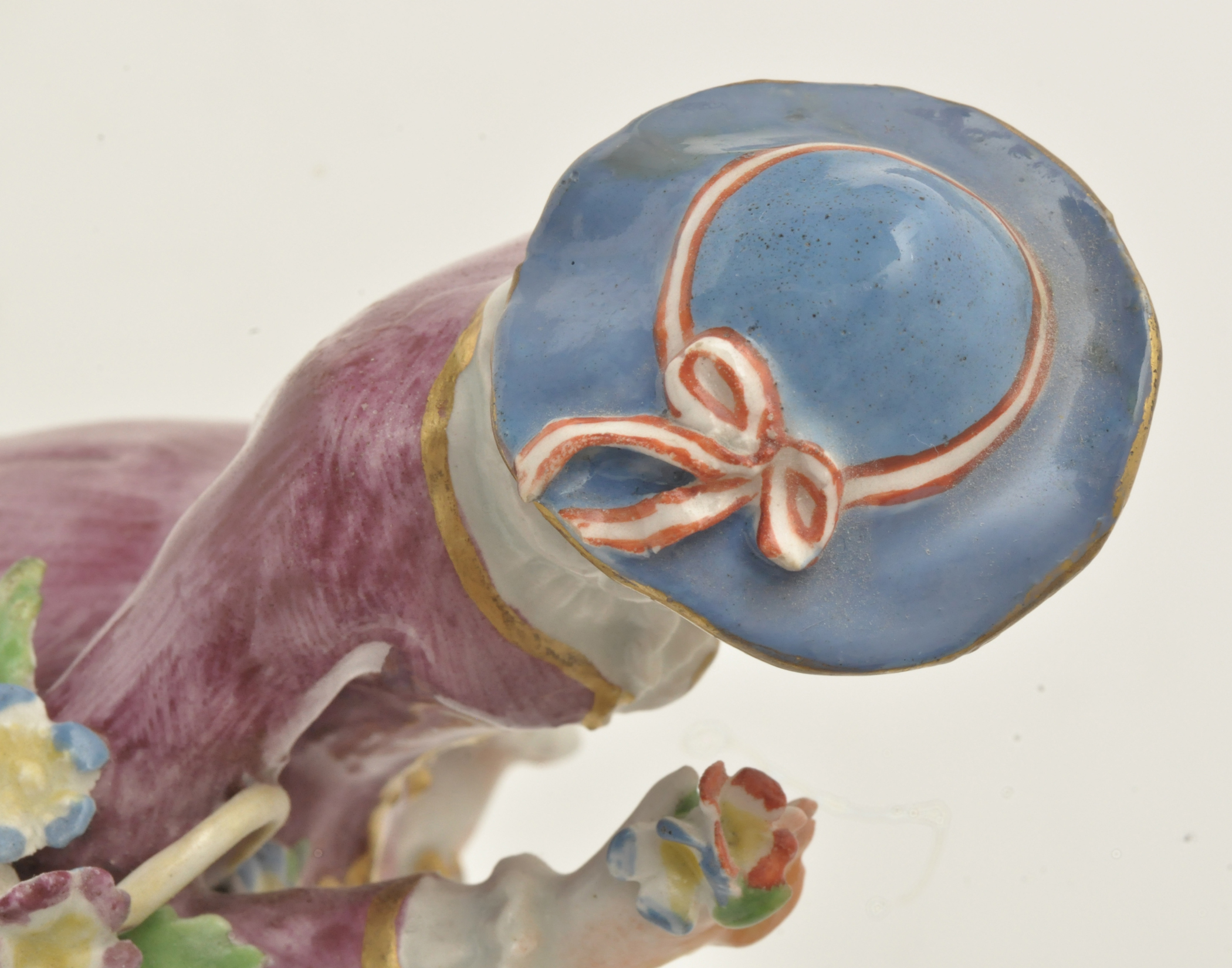 Bow figure of a flower girl, standing holding a basket of flowers over her right arm, - Image 12 of 12