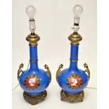 Pair of French gilt metal mounted blue ground porcelain lamp bases,