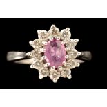 A pink sapphire and diamond cluster ring,