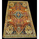 A Qashqai rug, the central floral medallion surrounded by foliate springs and flowerhead motifs,