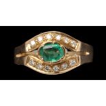 An emerald and diamond ring,