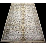 A woven Kashmir carpet, with full floral scrolling decoration on ivory ground, 306 x 195cms.