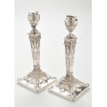 A pair of George V silver candlesticks, by Ellis Jacob Greenberg, Birmingham 1914,