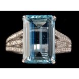 An aquamarine and diamond ring, the rectangular facet cut aquamarine weighing approximately 5.