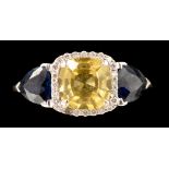A yellow sapphire, diamond and blue sapphire ring,