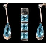 A topaz pendant and earrings, the pendant set three square facet cut stones in rectangular 18ct.