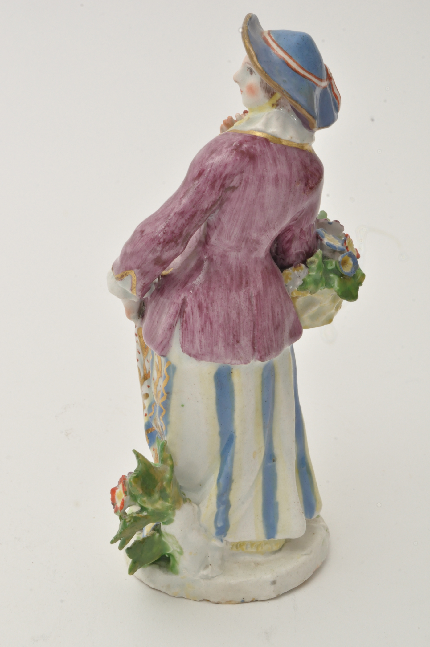 Bow figure of a flower girl, standing holding a basket of flowers over her right arm, - Image 4 of 12