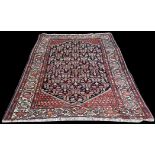 A Darjazin rug, the black ground with geometric floral pattern, 189 x 138cms.