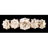 A five stone diamond ring, the graduated old cut diamonds weighing a total of approximately 1.