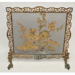 Chinese gilt bronze firescreen, with Buddhist lion upon flowering branch amidst clouds,