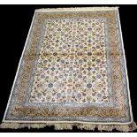A woven Kashmir rug, the ivory ground decorated with full floral scrolling design, 170 x 117cms.