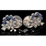 A pair of sapphire and diamond stud earrings, of flower and ribbon design,