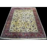 A Tabriz carpet, the floral scrolling design on ivory ground, 337 x 254cms.