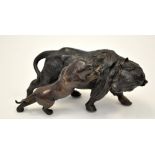 Japanese patinated bronze group of a tiger attacking a bison, character mark to base,