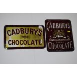 Two 'Cadburys Pure Chocolate' glass advertising signs,