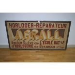 A French advertising canvas inscribed "Horloger-Reparateur, A.