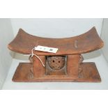 A South African carved wooden headrest.