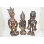 Yoruba Ibeji carved wooden figures.