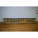 A 19th Century painted wood shop advertising cornice, inscribed "J.R. Birkett & Sons, Ltd.