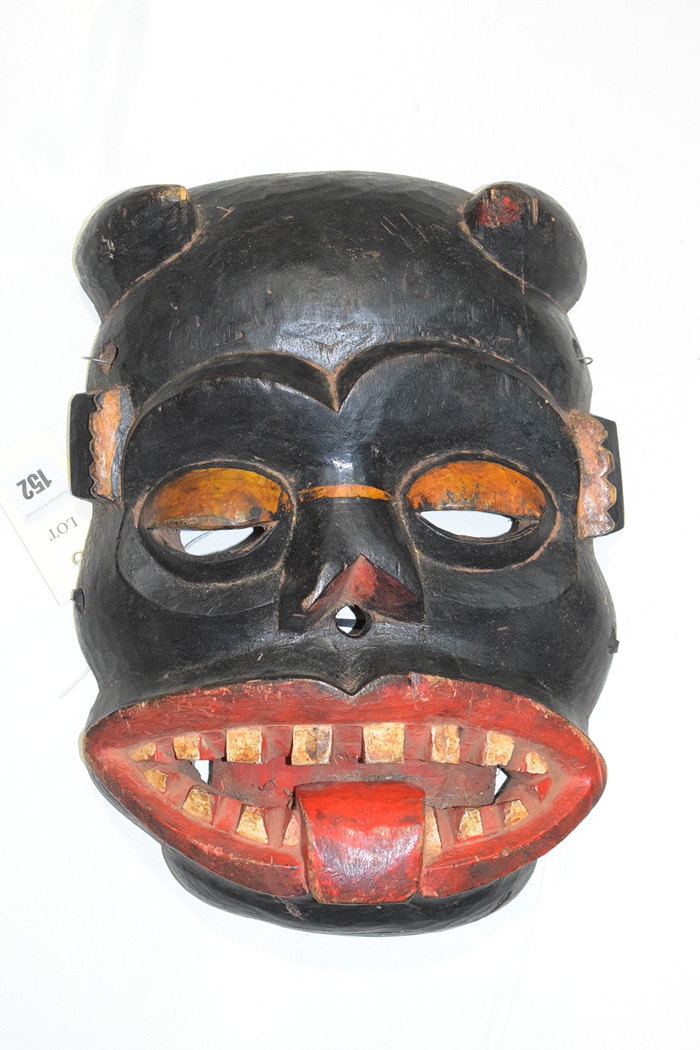 An African tribal carved wooden mask.