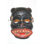 An African tribal carved wooden mask.