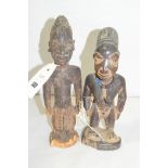 Yoruba Ibeji carved wooden figures, one female; one male.