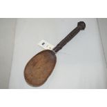 A West African carved wooden spoon, 36cms.