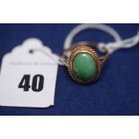 A jade ring on 9ct. yellow gold shank, ring size N.