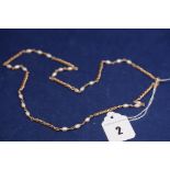 A 9ct. yellow gold and cultured pearl necklace, 13.3grms.