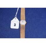 A 9ct. yellow gold ladies wristwatch, by Omega with baton numeral dial, 29.5grms. gross.