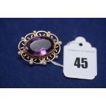 An amethyst and seed pearl brooch, the oval facet cut amethyst measuring, 22 x 14 x 10mm, on 9ct.