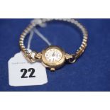 A 9ct. yellow gold cased Roamer Incabloc Swiss made ladies cocktail watch with arabic dial.