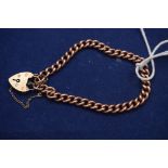 A 9ct. yellow gold curb link bracelet with locket clasp, 19grms. gross.