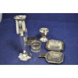 German and British silver items, to include: a vase, a tea strainer on stand, two napkin rings,