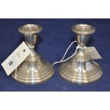 A pair of silver dwarf candlesticks, by Barker & Sons, Sheffield 1978, with filled bases.