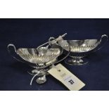 A pair of table salts, half reeded boat form, by William Hullan & Sons.