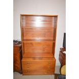 A teak open bookcase, fitted three shallow drawers in the base, 92cms.