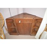 A mid 20th Century G-Plan stained wood three-piece unit,