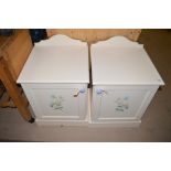 A pair of painted bedside cabinets, 50cms each.