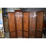 A modern carved Oriental hardwood four-fold screen with pierced decoration;