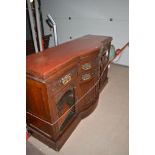 A Victorian carved and stained walnut sideboard base, fitted a combination of four drawers,