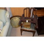 An Edwardian stained mahogany carver chair; an oak oval bevelled wall mirror;