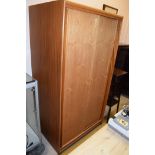 WITHDRAWN - A teak single wardrobe with double sliding doors, 90cms wide.