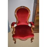 Victorian walnut frame salon chair with red velvet upholstery.
