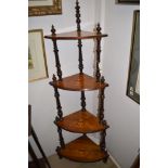 A Victorian inlaid walnut four tier graduating whatnot.