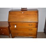 A mahogany slope front bureau fitted with three drawers, 92cms wide.