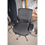 A black finish office chair with chromed wheel base.