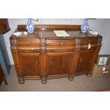 A 1920's oak bowfront sideboard, 151cms wide.